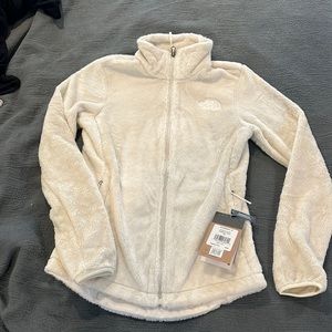 The North Face women’s XS cream fleece zip-up jacket. NWT
